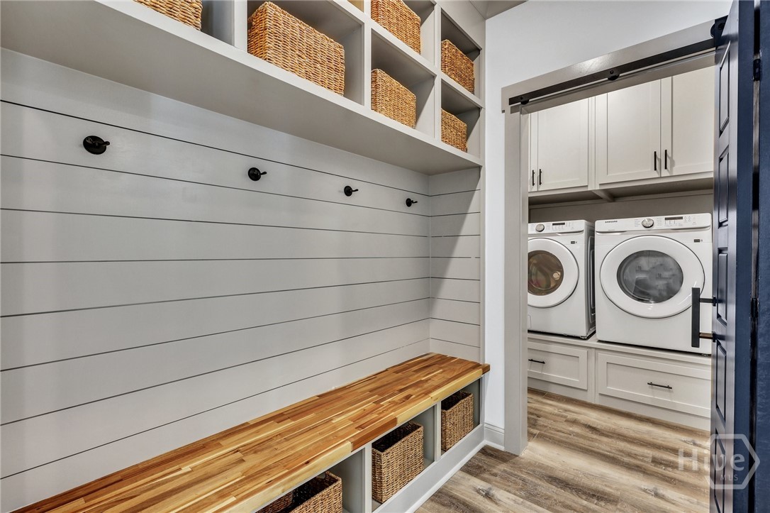 PHOTOS OF A PREVIOUSLY BUILT BRINSON PLAN BY LAWRENCE ALEXANDER HOMES.