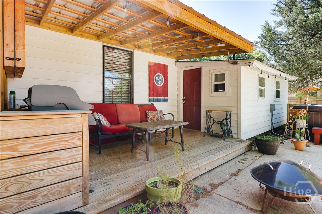 Back patio with outdoor kitchen and TV