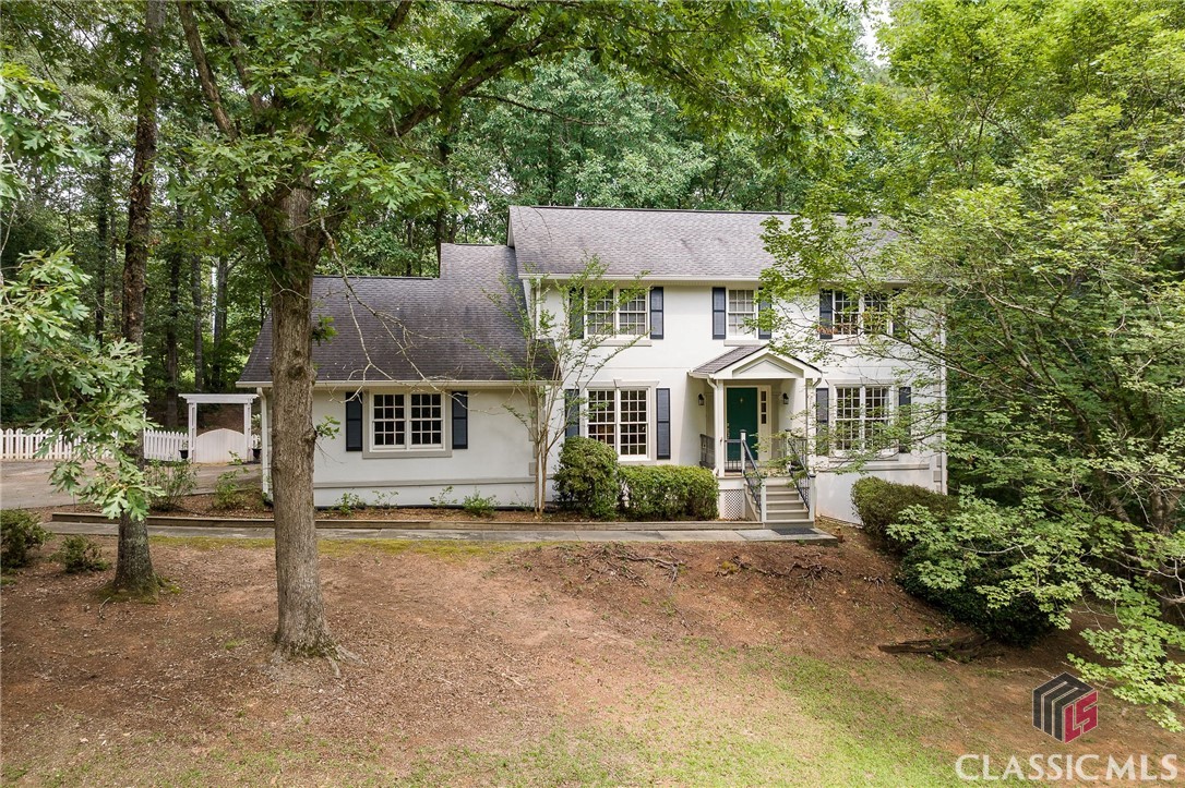 If you looking for a peaceful home in a convenient location, look no further than 1071 Campbellton Place in Hickory Hill. Hickory Hill is an established neighborhood with mature trees and large lots. This well maintained 4 bedroom, 3.5 bathroom house is centrally located between downtown Watkinsville and East Athens. This home has a spacious first floor with multiple living areas, dining room, kitchen and breakfast area all on the main level. All four bedrooms are located on the second floor with a primary ensuite and a shared second bath for the other three bedrooms. The main level and all bedrooms have wood flooring. The lovely screen porch is a highlight of the property, offering a peaceful retreat where you can relax and enjoy the fresh air and listen to the fountain in the koi pond. The partially finished basement provides even more space and flexibility, with room for a home office, gym, or additional storage. You can customize this area to suit your needs and preferences, making it a valuable asset for your family's lifestyle. The stucco exterior has been inspected and warrantied by SIR.