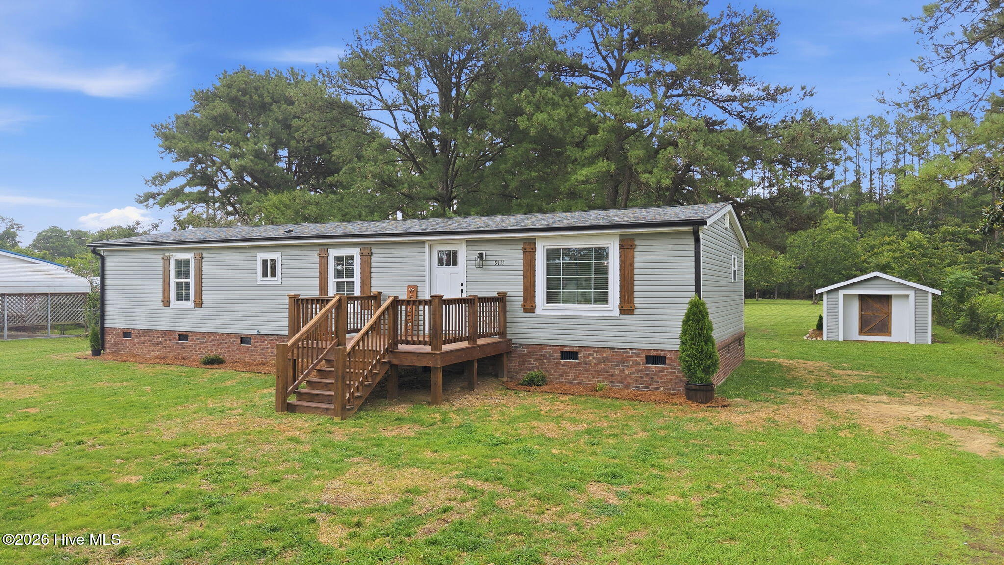 Updated mobile home on over an acre in Bailey. Open Floor Plan includes Living Room, Kitchen, Dining Area, and Den.  Luxury Vinyl Plank thorughout. Master Bedroom with Full Bath en suite including newly tiled shower and walk-in closet. 2 Guest Rooms share Hall Bath with custom-tiled shower and floor.  20 X 12 Shed in Back Yard for more storage.