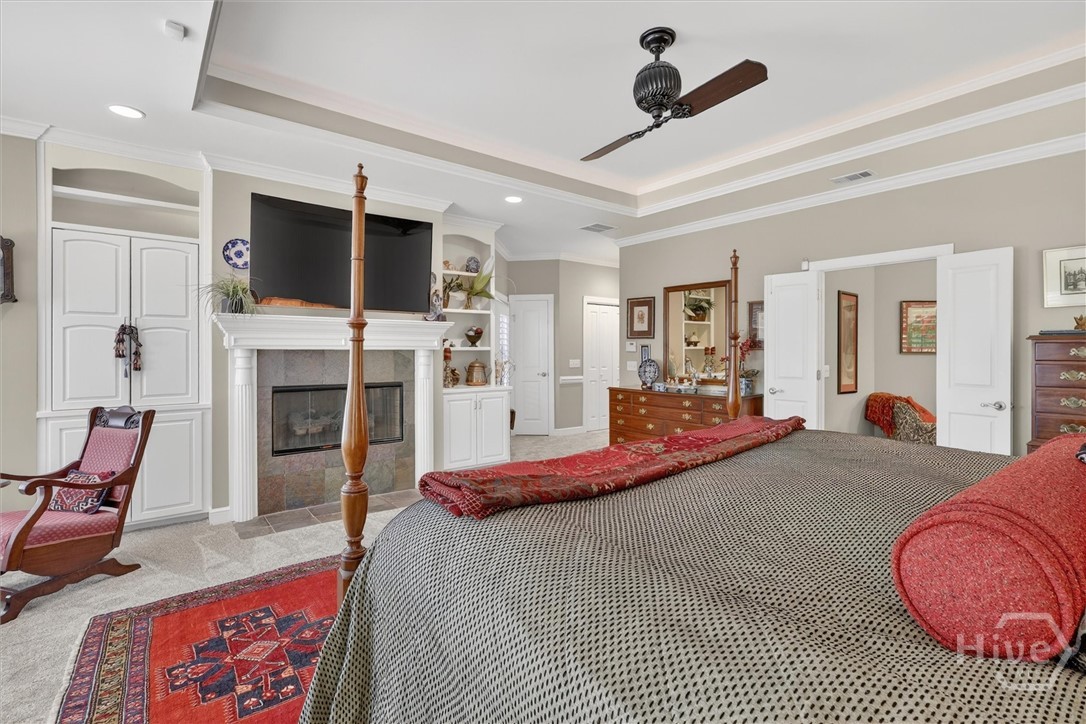 The primary suite has built-ins, a gas fireplace,