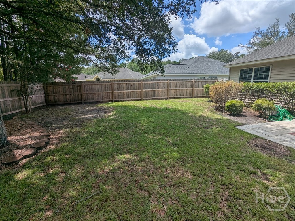 Backyard with wood privacy fence.