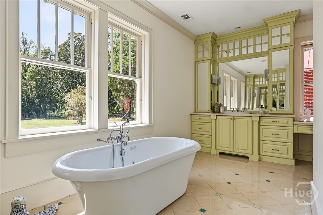Primary bath with soaking tub and vanity