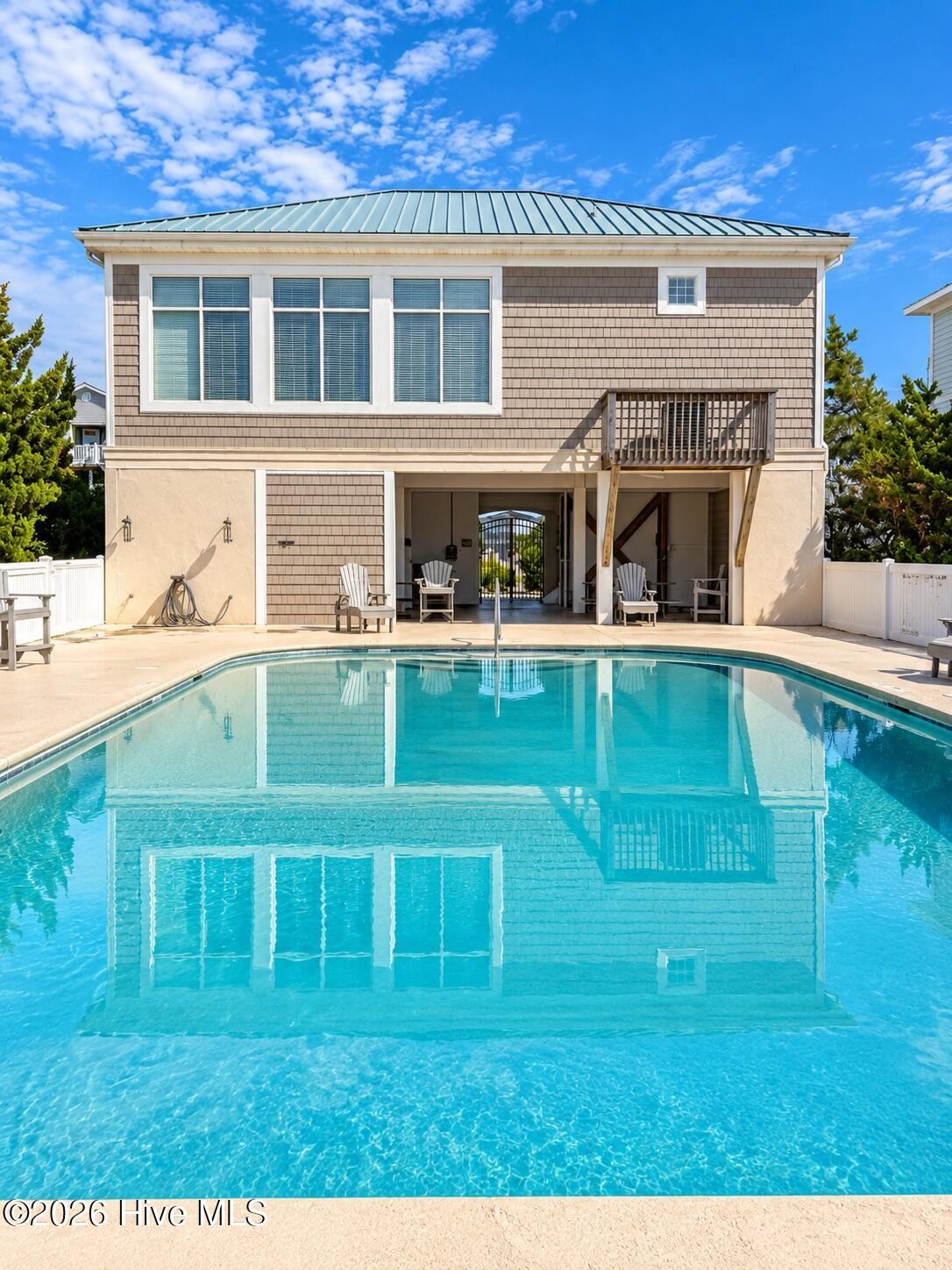 Oceanfront club house and pool with private beach access.