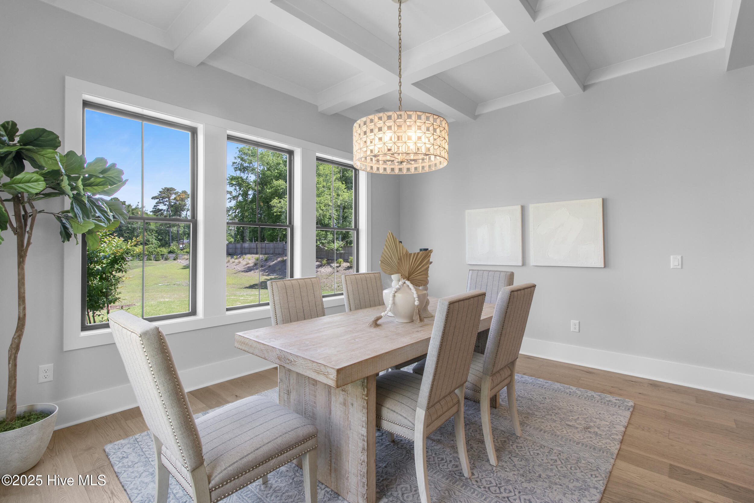 Large windows to enjoy the pond with fountain and community green space behind the home