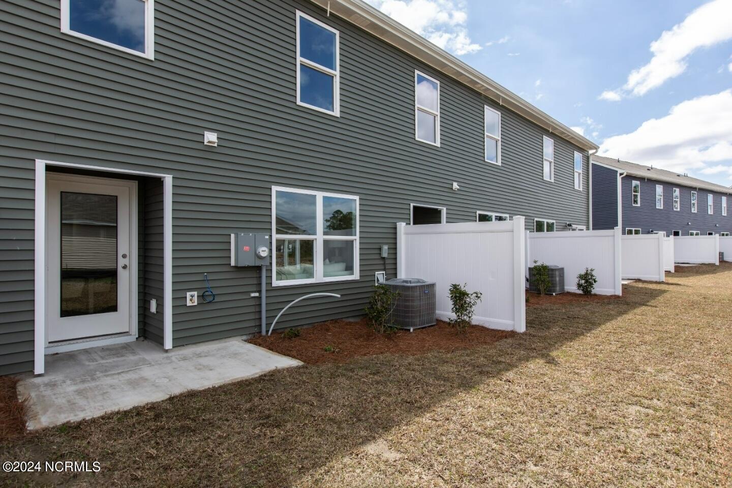 7098 Dunford Road Unit 130, Leland, NC 28451 – photo 21: Back of Townhomes