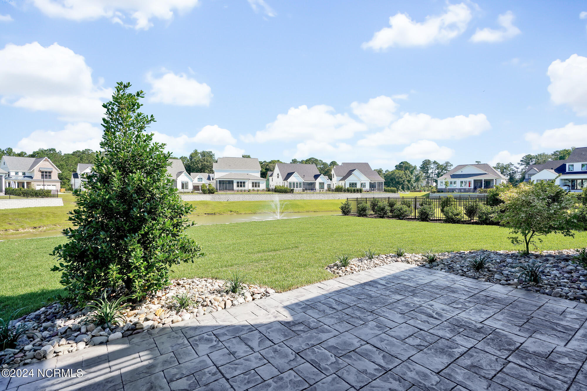 Extensive landscape in backyard fullly fenced with views of the pond and fountain!