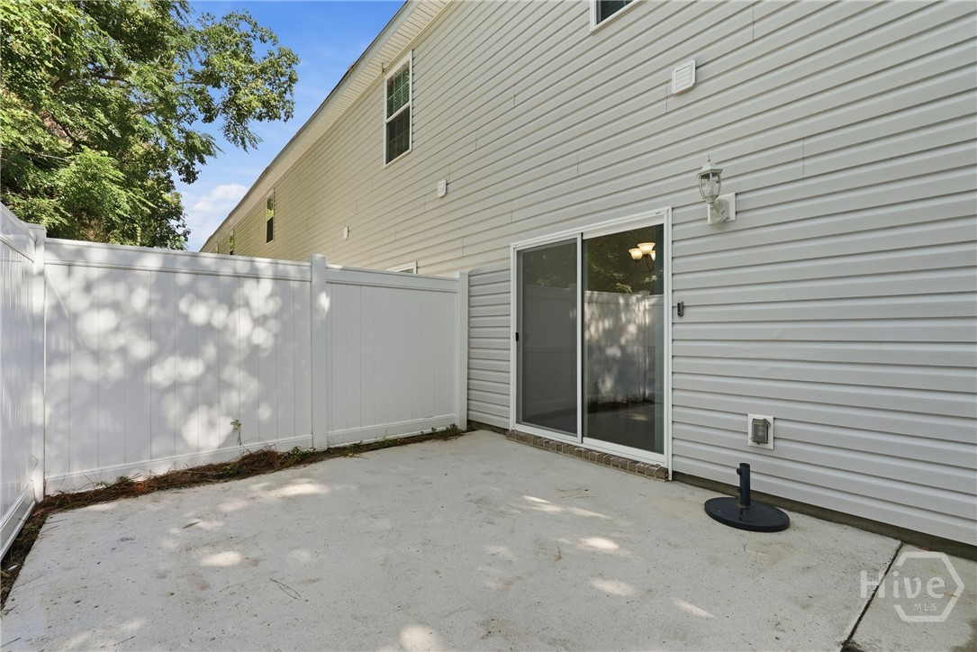 Privately, fenced patio offers outdoor living space.