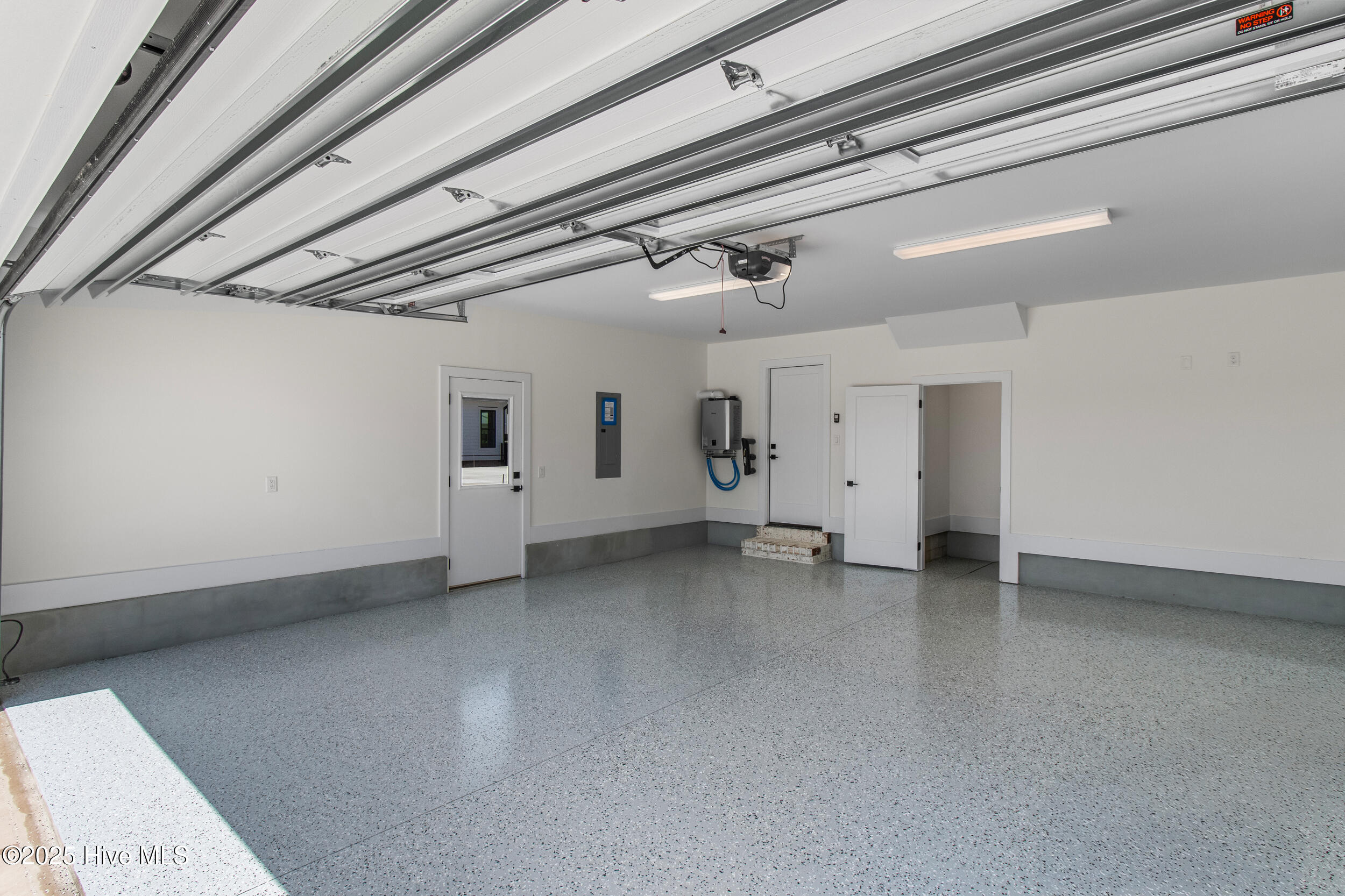 2 car garage with epoxy flooring and natural gas water heater