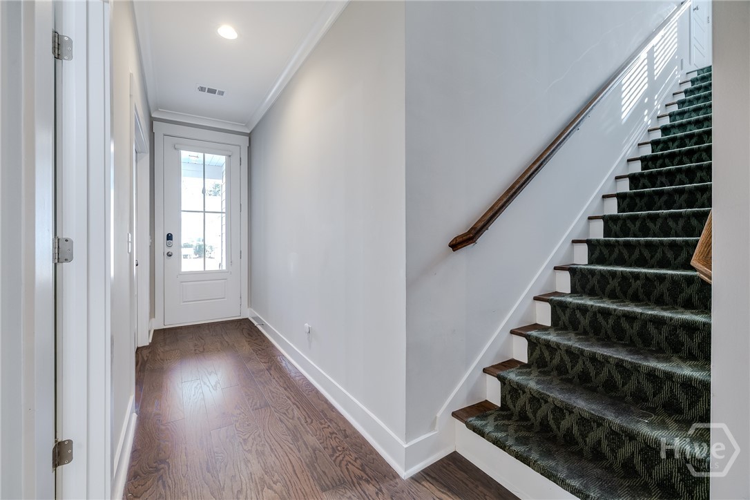 Front Foyer and staircase with rails on either side to second level