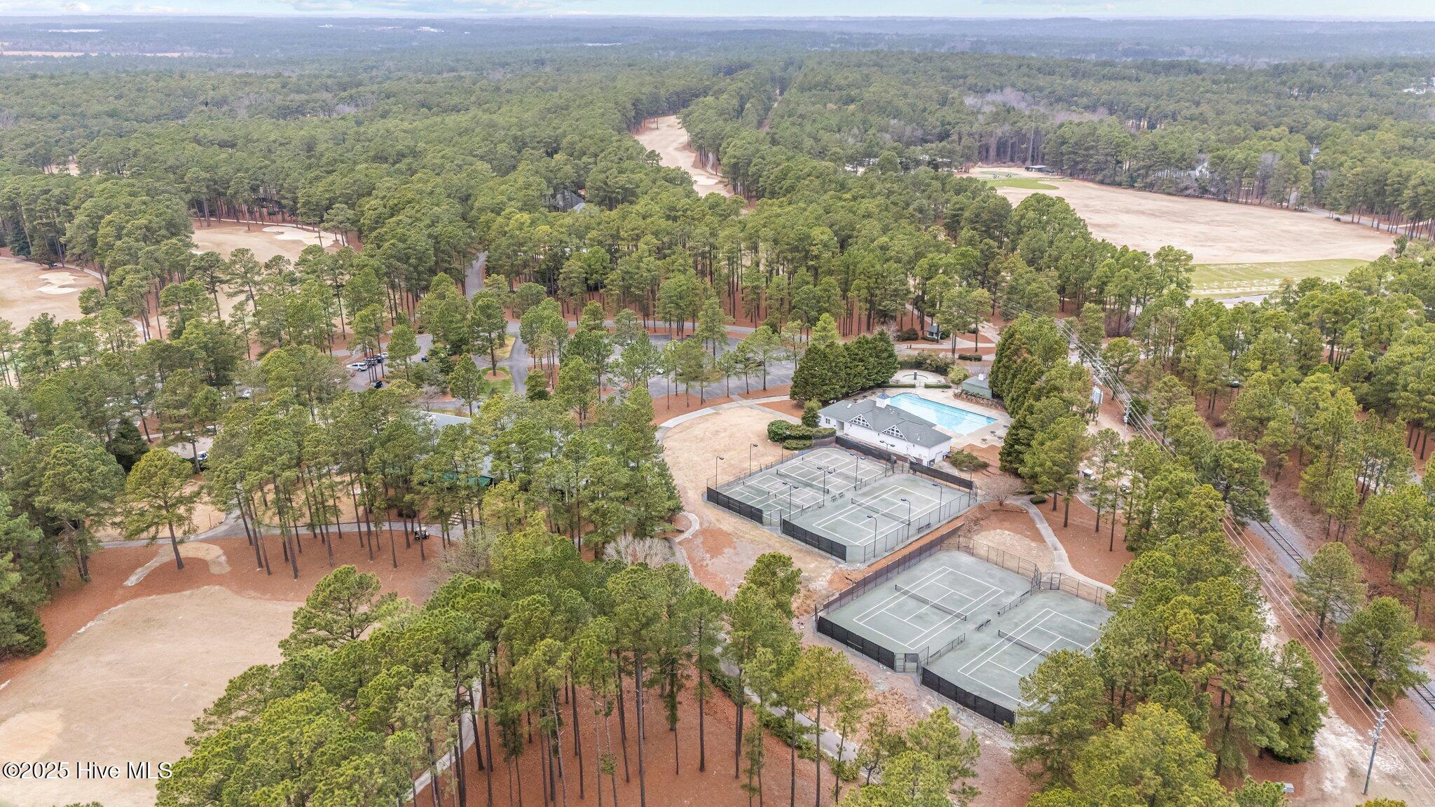 Situated steps to the clubhouse, courts and pool