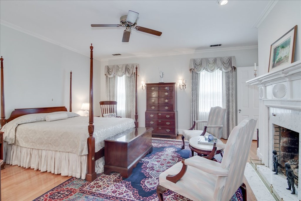 Second bedroom featuring a fireplace and bath