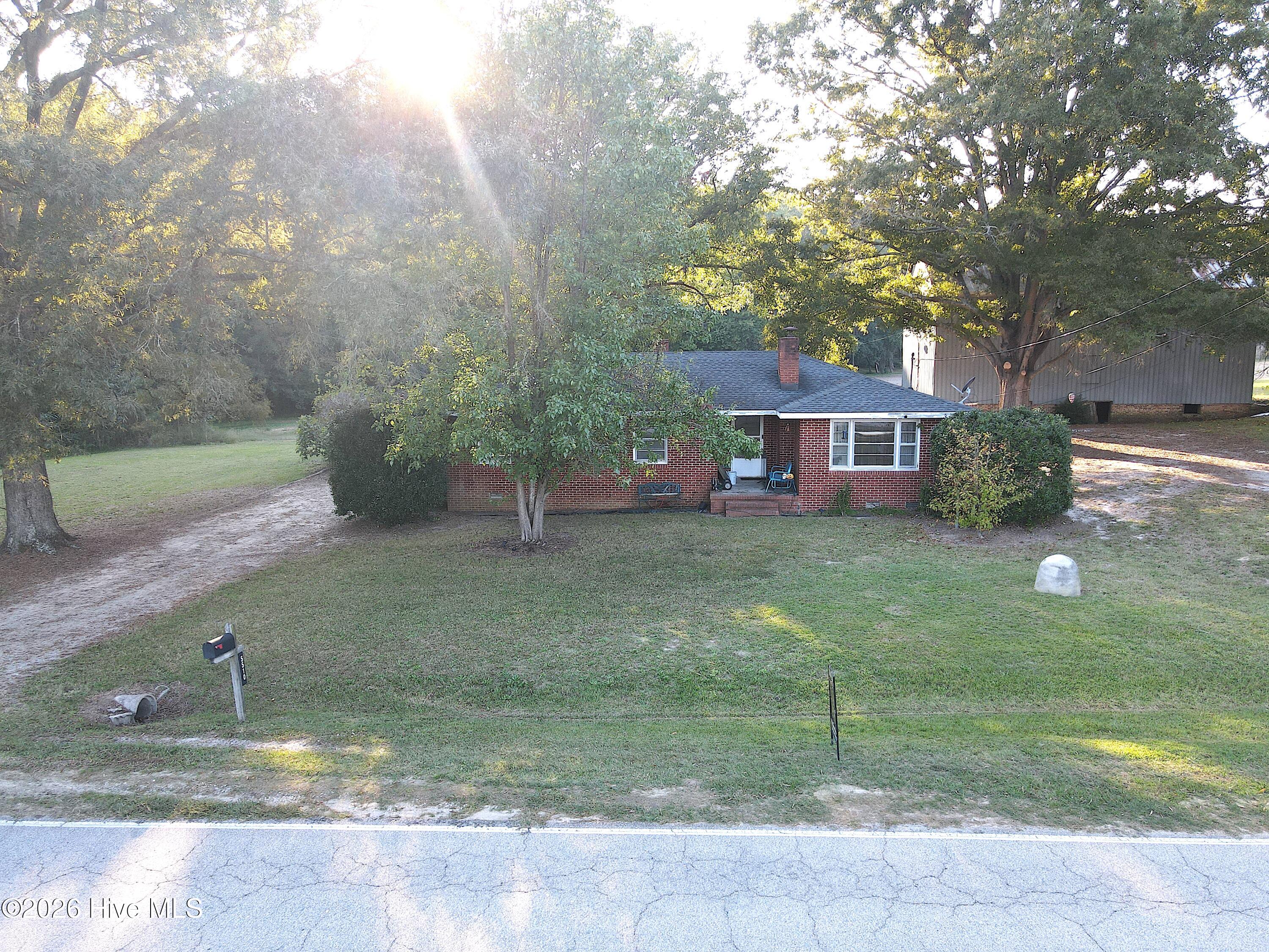 Country living with room to roam! 3BR/1BA brick ranch sitting on 2.73 acres in the desirable Rock Ridge school district, offering plenty of space to enjoy the peace and privacy of country living. With an impressive 674 feet of road frontage, this property offers plenty of possibilities for the future. Inside, you'll find fresh paint throughout and a cozy living room with fireplace, kitchen featuring updated flooring and countertops with knotty pine walls & cabinets, and a refreshed bathroom with a reglazed tub and tile surround. If you're looking for a home with land and room to make it your own, this property is full of potential! Call today to learn more!