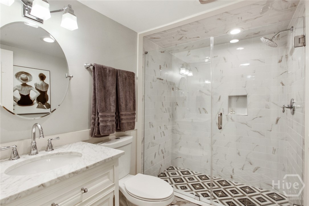 Gorgeous full bath with walk-in tiled shower.
