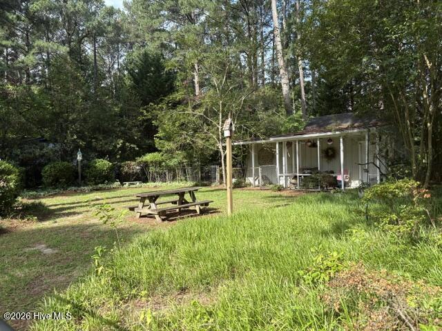 Wired shed with porch-- a bonus space that can be left as is for great extra storage or prettied up for that little getaway space you've wanted