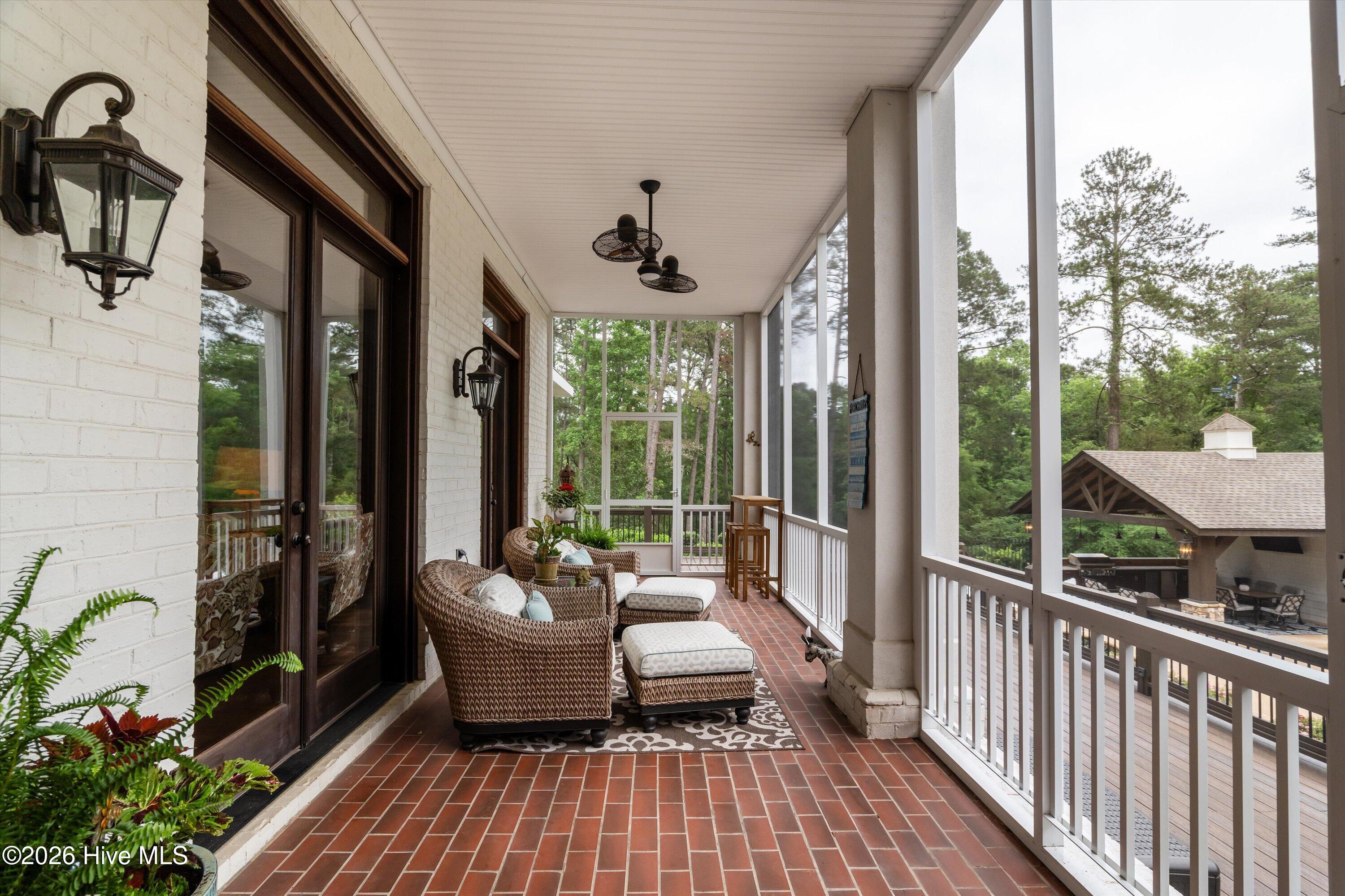 Back screen porch with access from living room and kitchen overlooking pool and bakyard