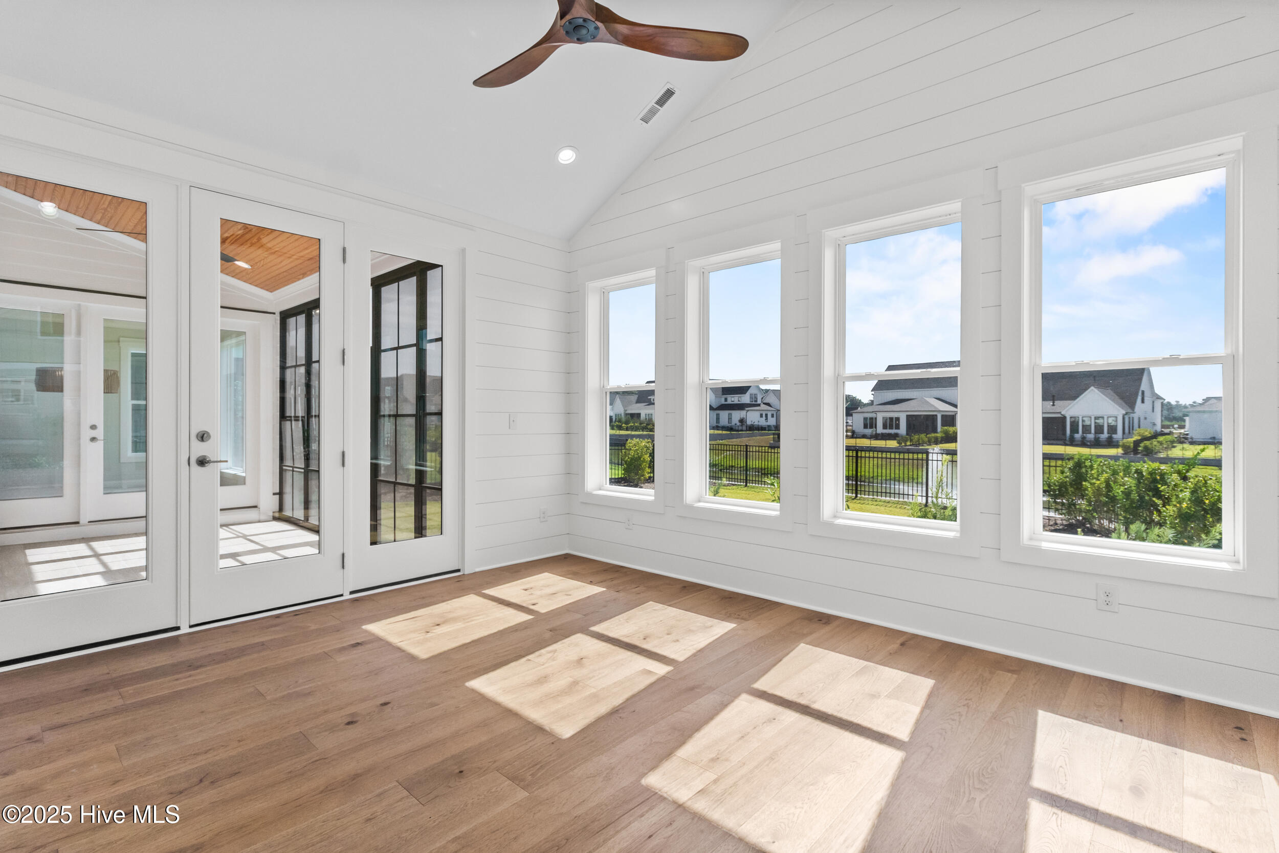 Sitting room with high ceilings and natural light
