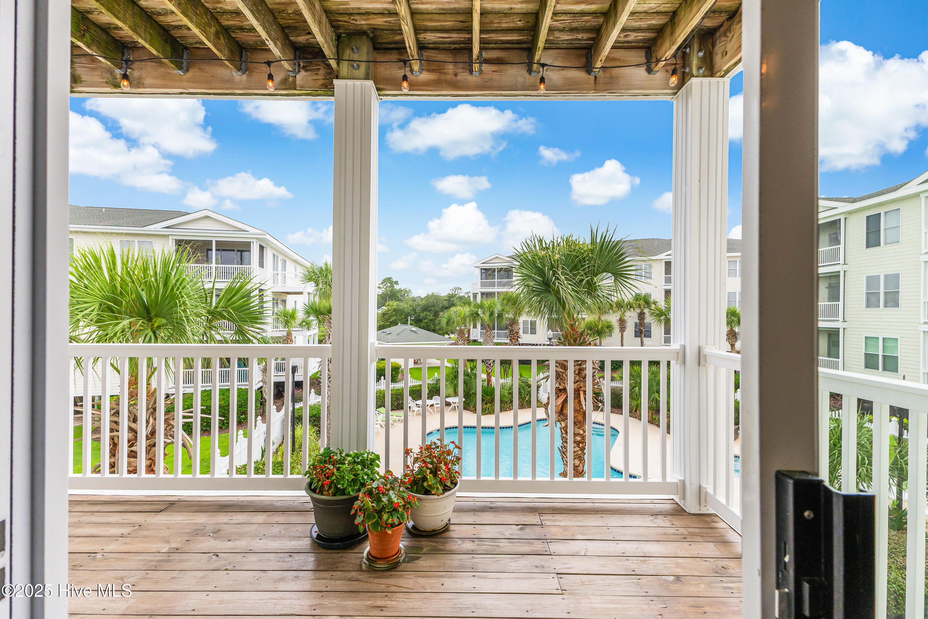 1135 Park Road SW Unit 4201, Sunset Beach, NC 28468 – photo 23: Large, covered porch off dining area