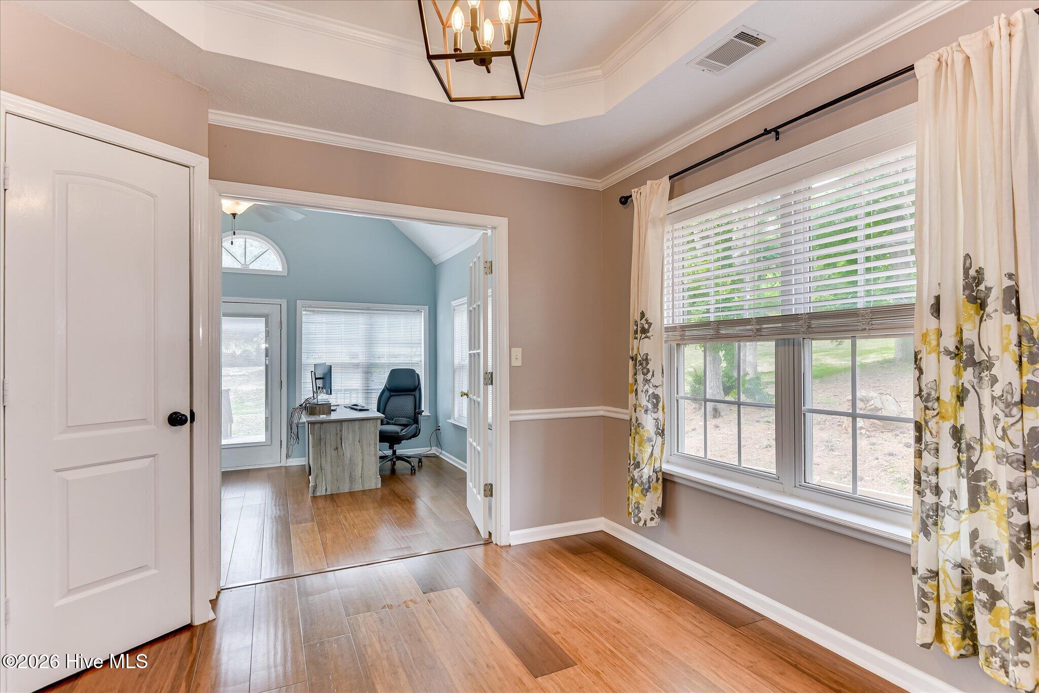 Kitchen flows easily into nice sized sunroom that overlooks back yard.