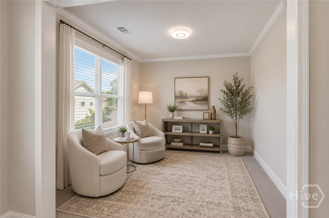 Sitting Room in the Primary Bedroom (staged virtually)
