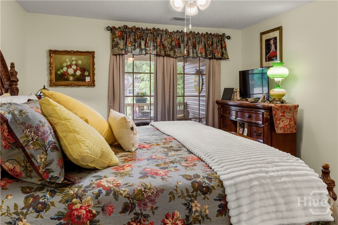 Primary bedroom with access to the porch
