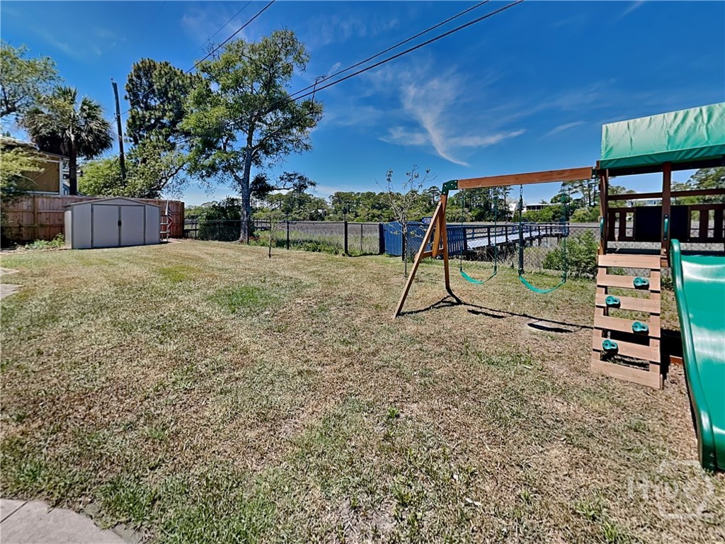Fenced yard and generous storage shed