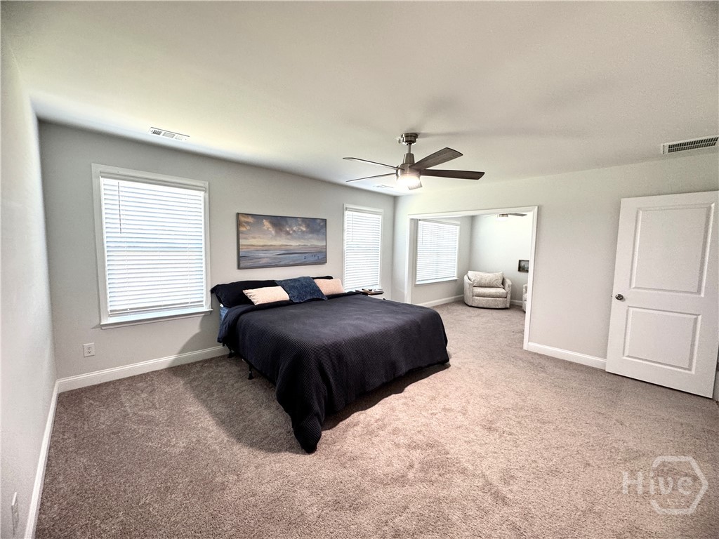 Owner's Suite is large with Master Bath w His & Her Closets, Double Vanities and this large tiled Shower  plus sitting area or study.
