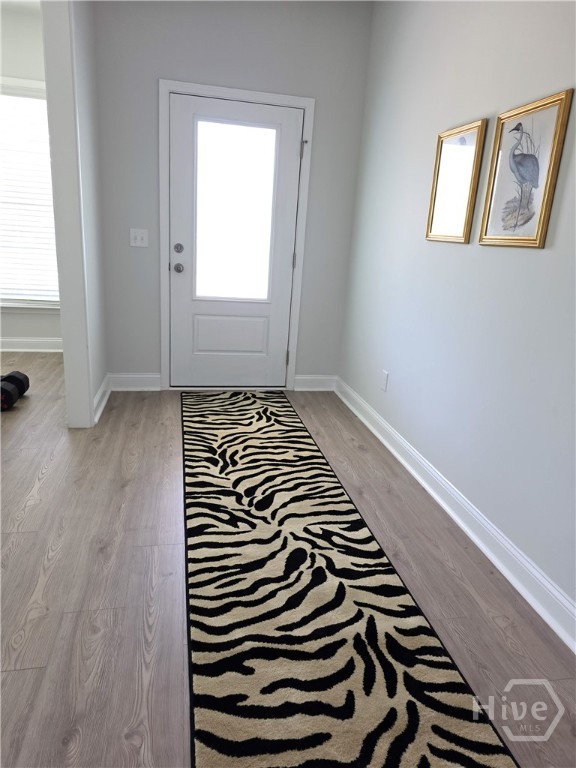 Light-filled Foyer opens to Dining Room and Great Room