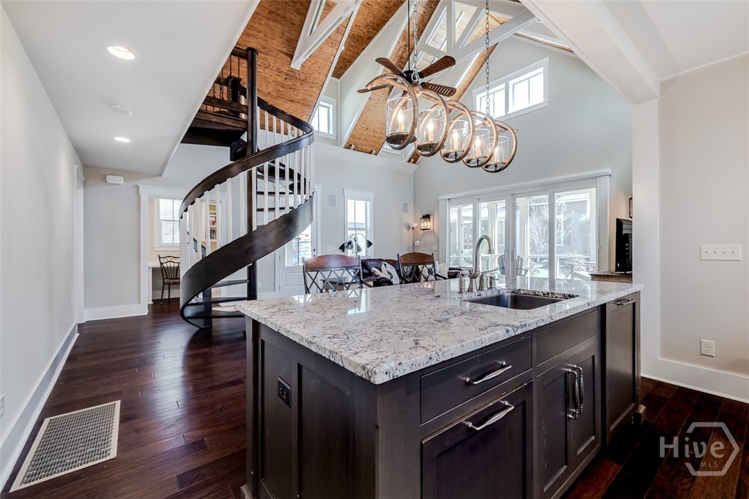 Open island with dishwasher and single bowl sink