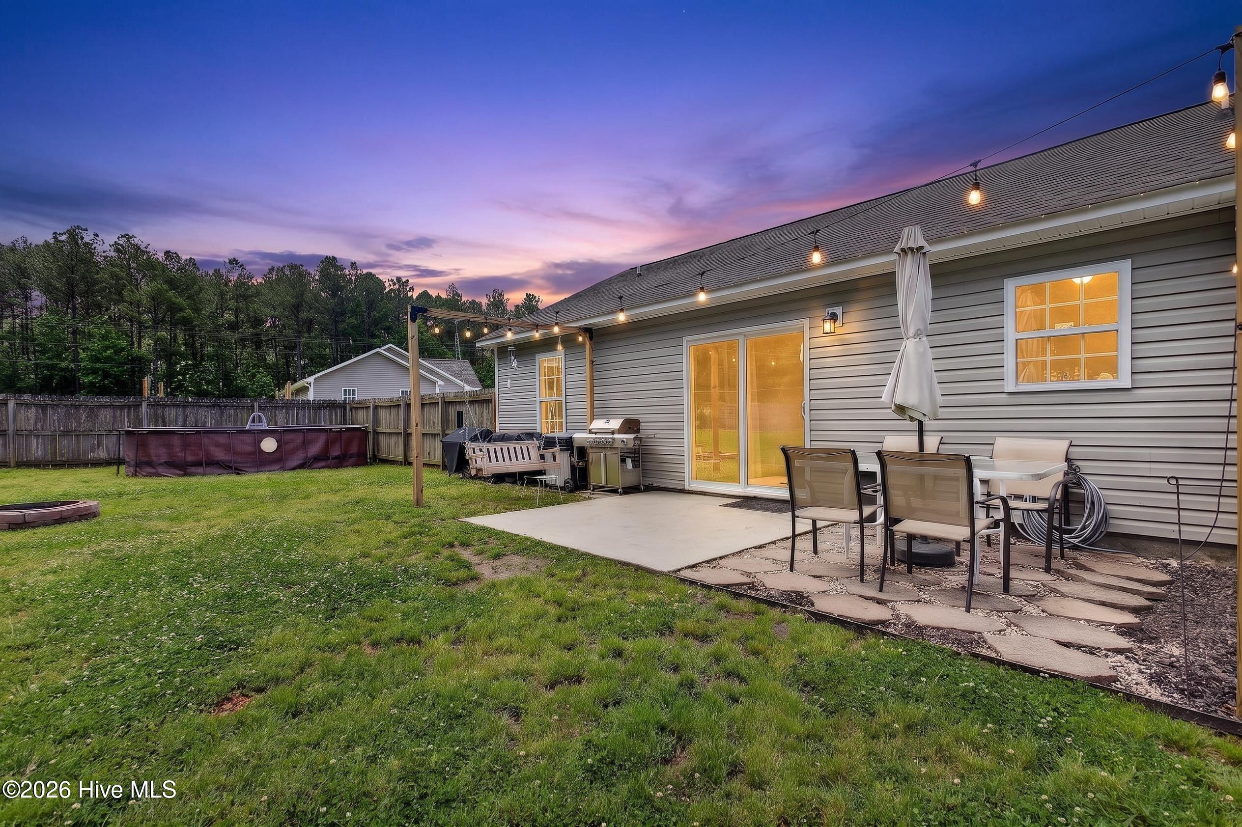 102 Blossom Court, Maple Hill, NC 28454 – photo 2: 102 Blossom Twilight Backyard