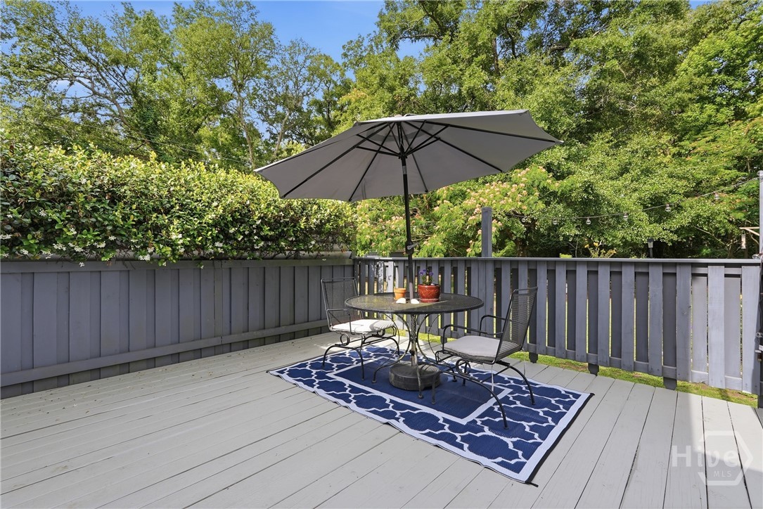 The outdoor deck has space to entertain guests and