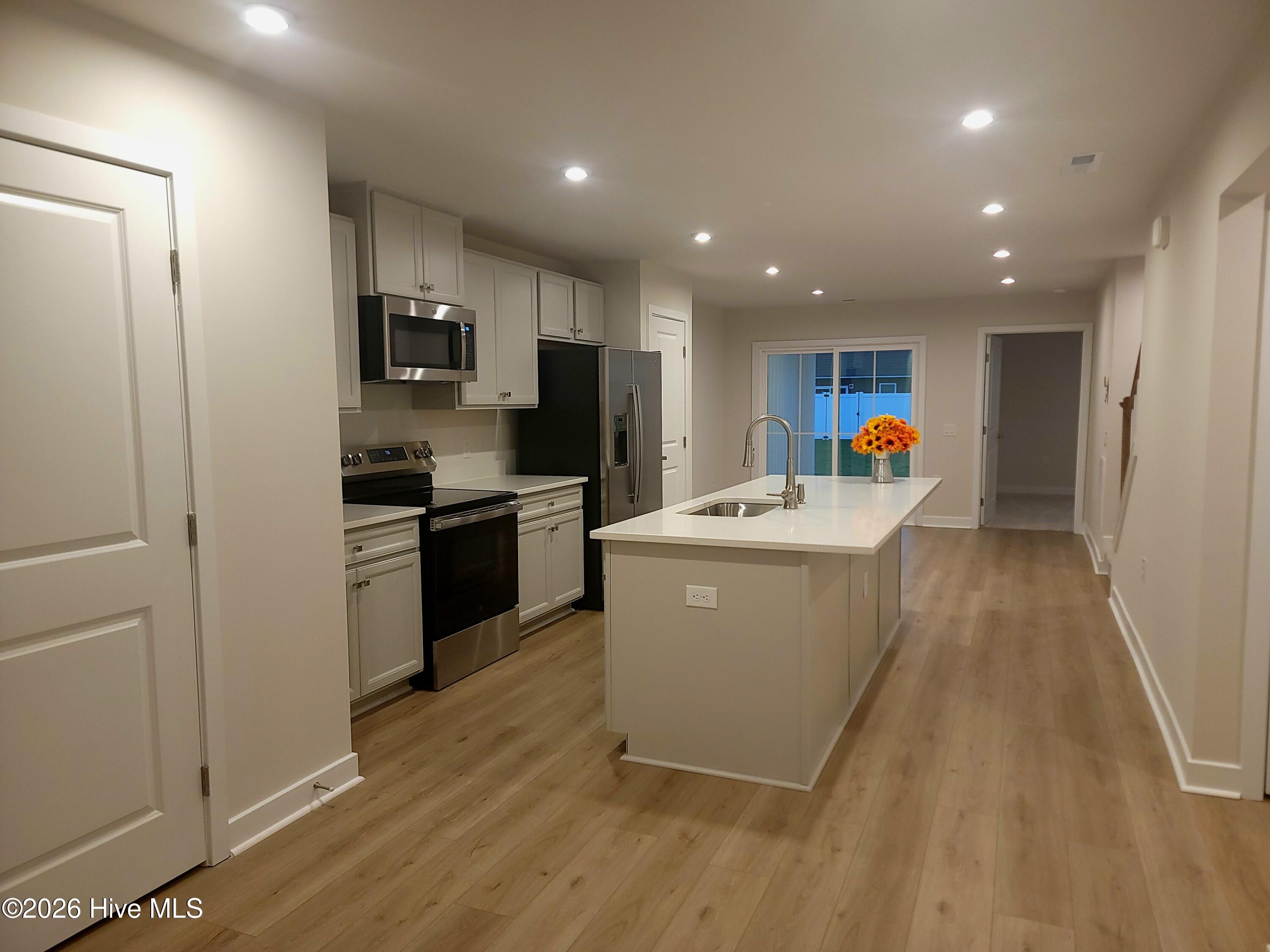 Great open living space! Living room, kitchen and patio.