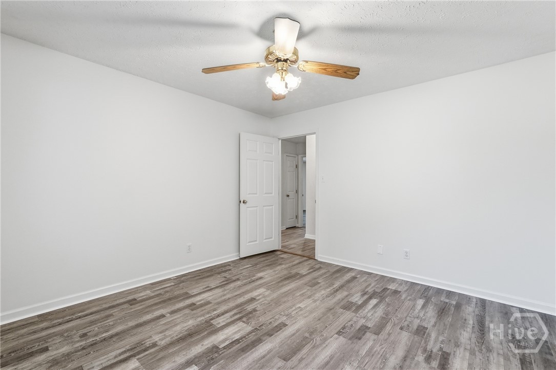 This is the first of three bedrooms. Freshly painted and brand new LVP floors.