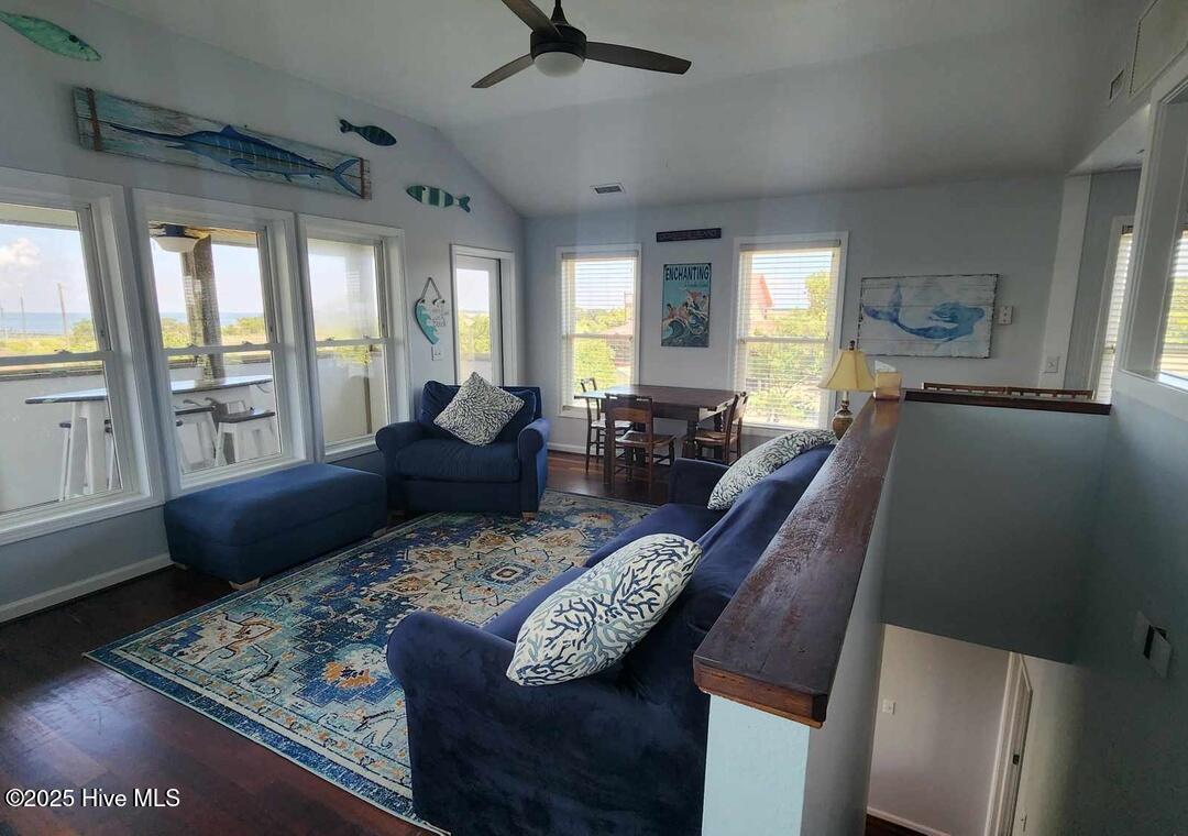 Open concept living room, freshly painted, views of the sound and access to your sundeck and screened porch.