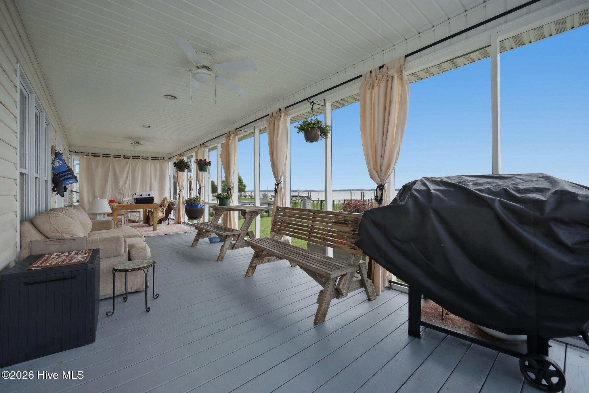 Shady screened porch with a cool river breeze.