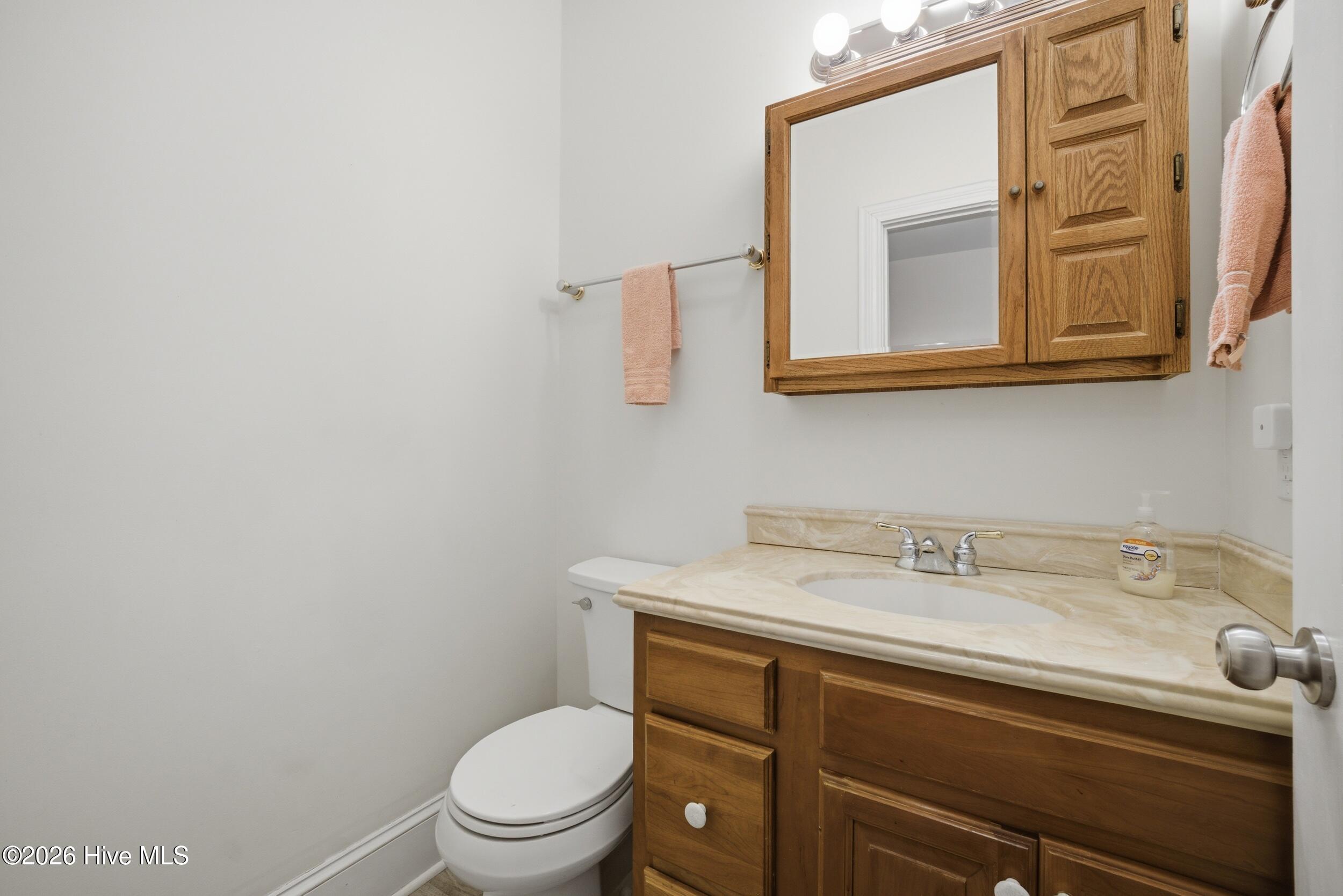 1st floor additional half bath off laundry room