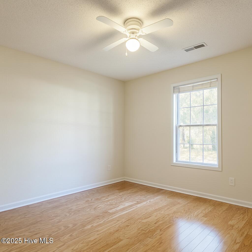 9117 Landing Drive SW, Calabash, NC 28467 – photo 15: Sunny Suburban Bedroom Interior