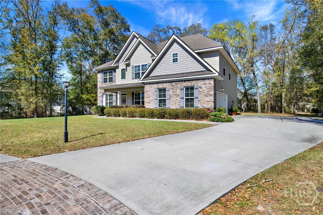 Front Exterior with Brick Accent Driveway