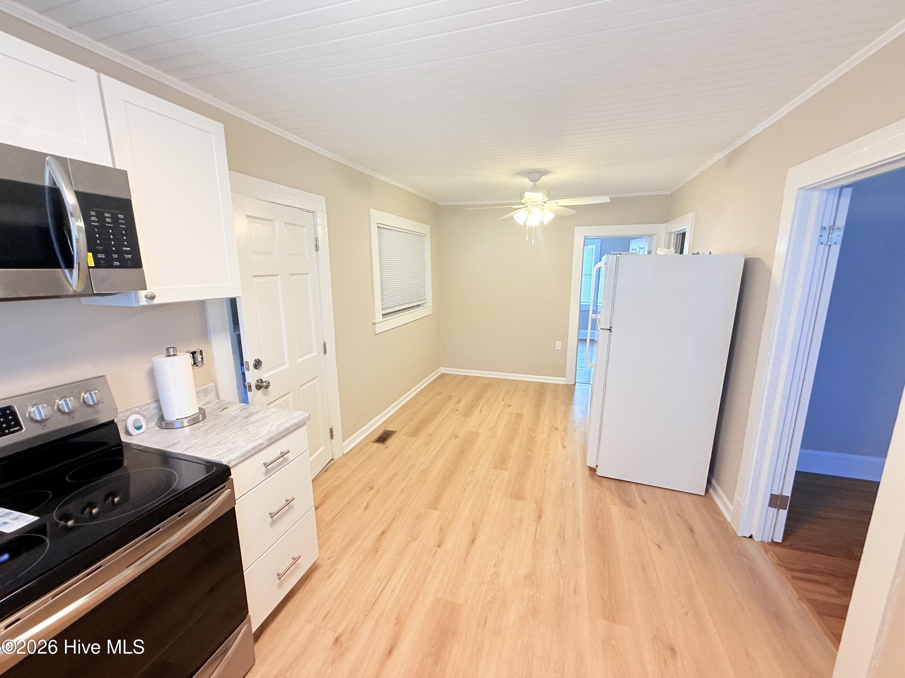 Additional view of kitchen with a breakfast dining area.