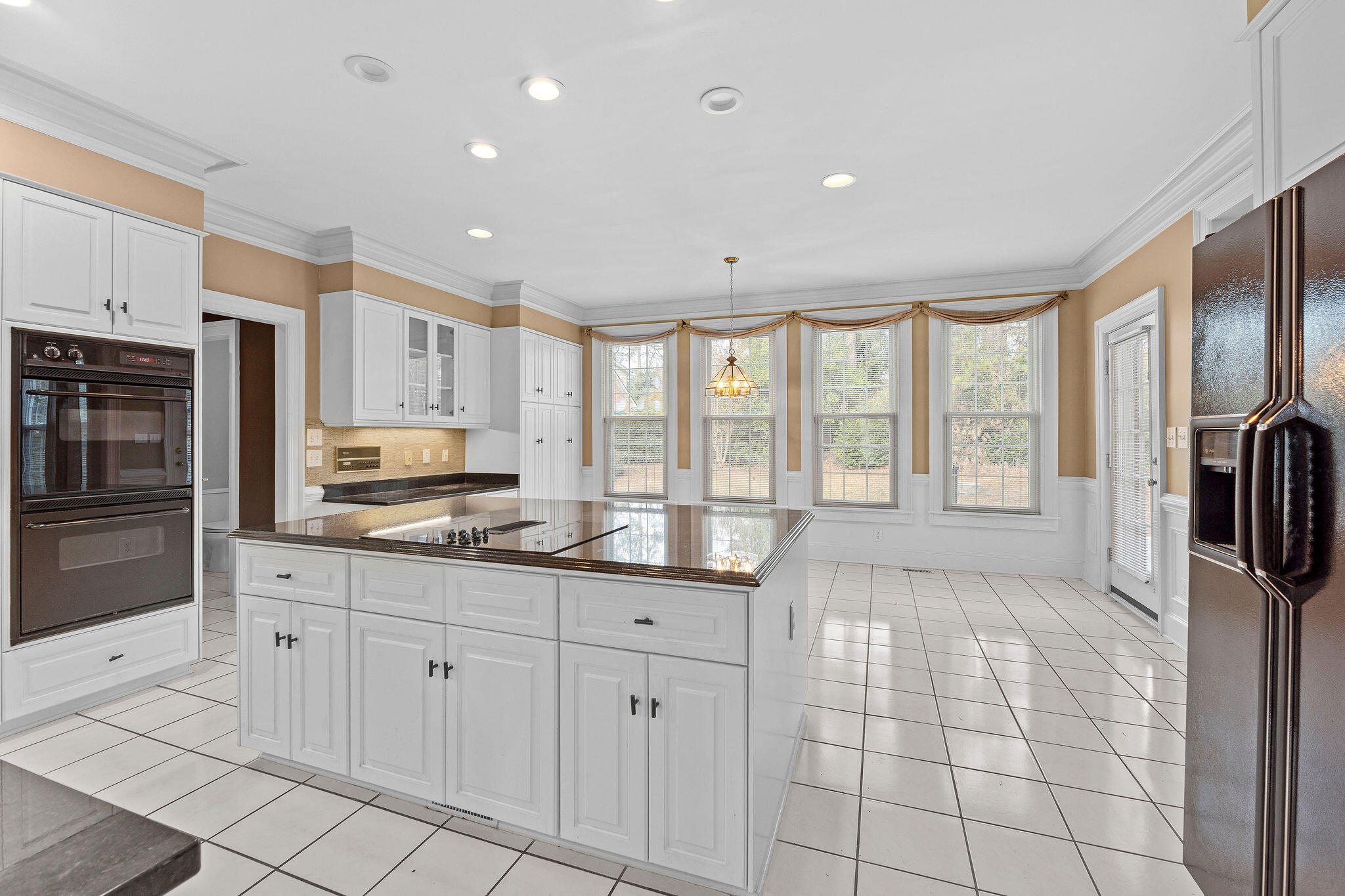 Bright, modern kitchen that opens to large breakfast room with a view!