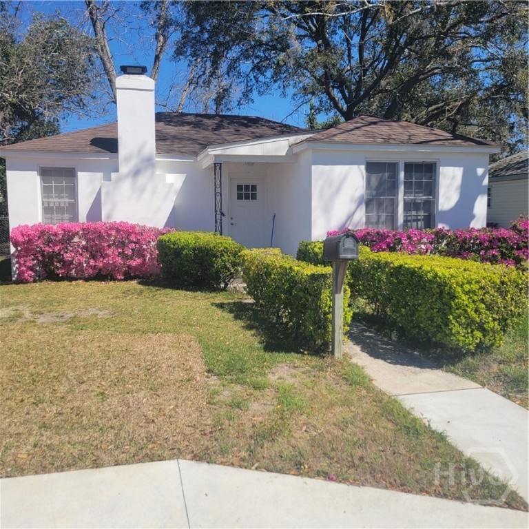 Azaeala bushes are on both sides of the home.