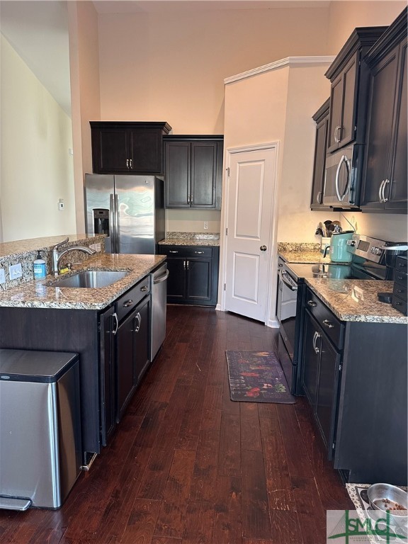 Kitchen, open to family room. Stainless appliances