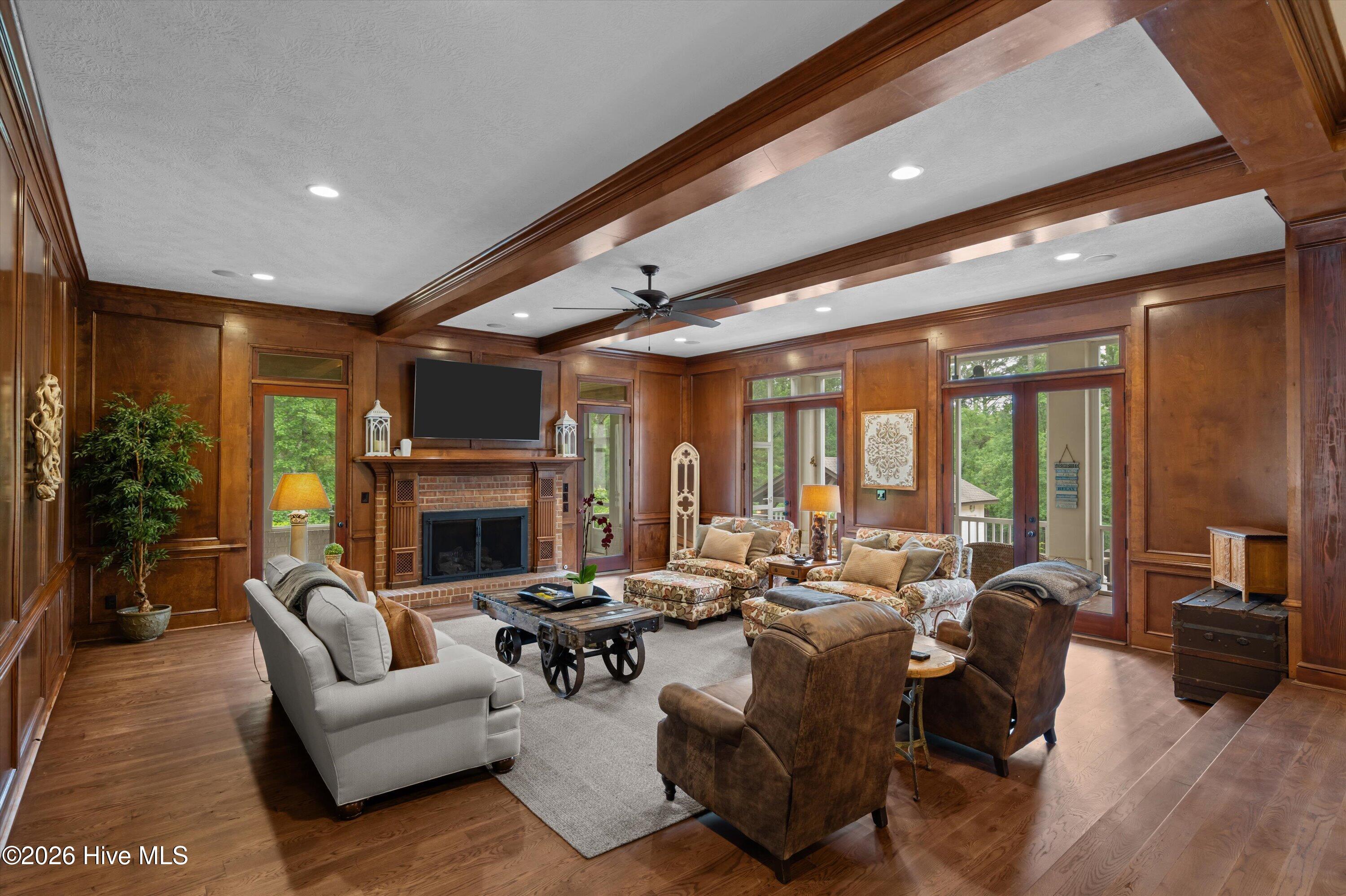 Living room opens to a side enclosed porch with a hot bub and double French doors to back screened porch