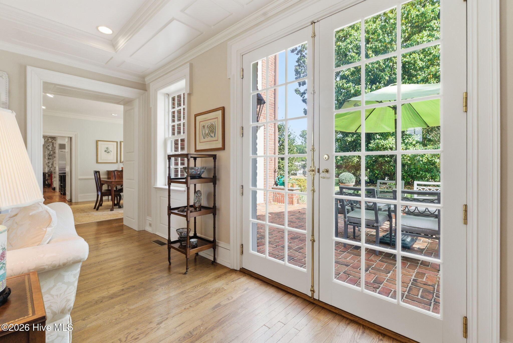French doors to outdoor terrace. Drawing room open to formal dining room