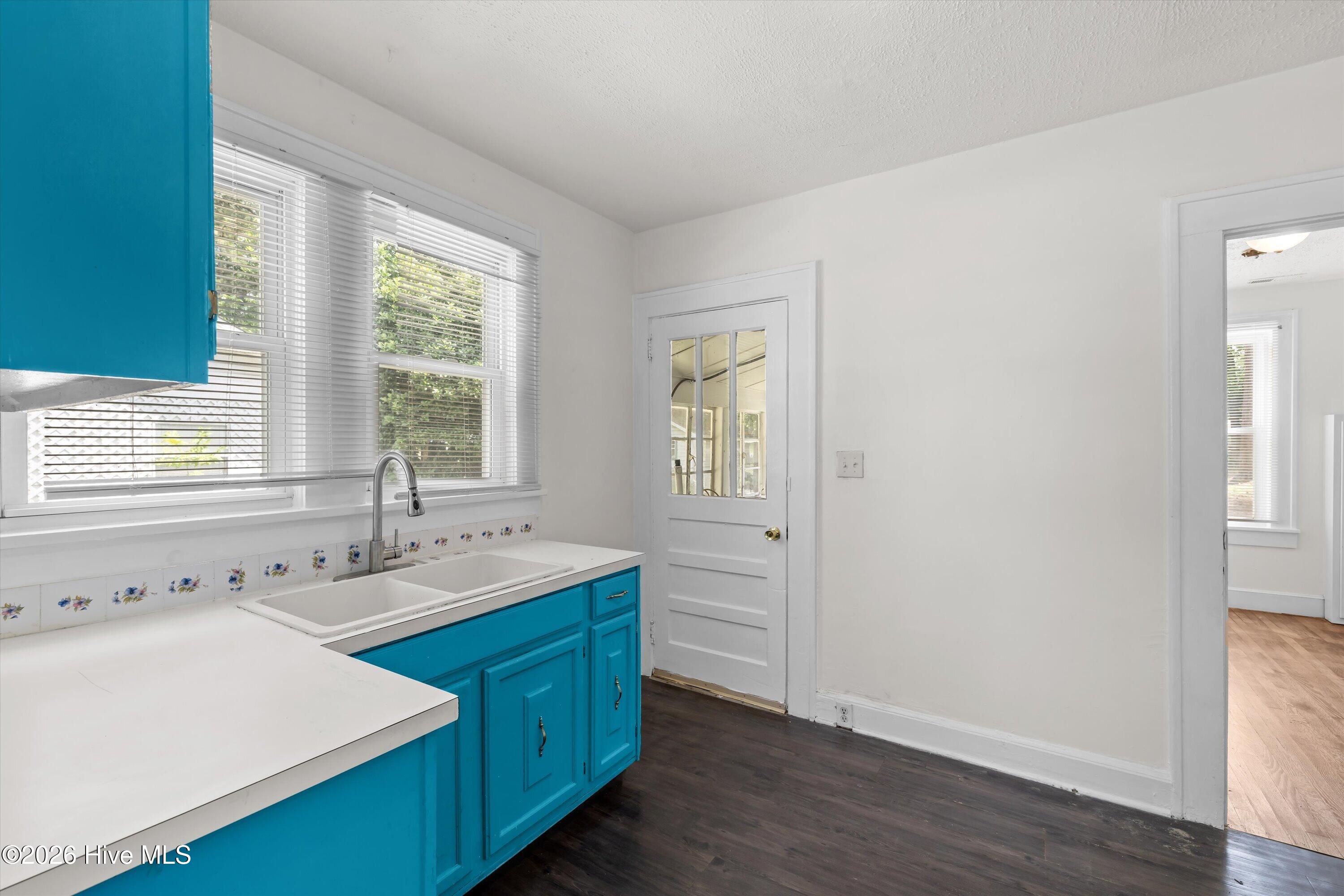 Kitchen opens to laundry porch