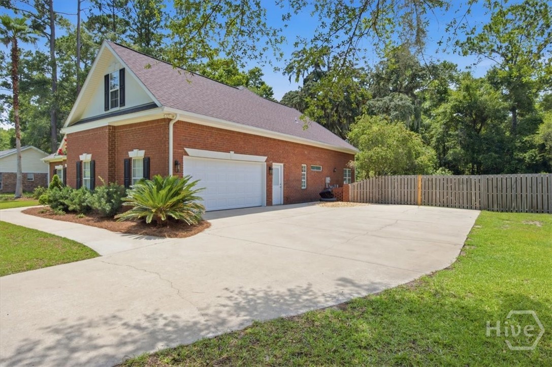 Side entry garage with separate side door for the separate bonus room over the garage.