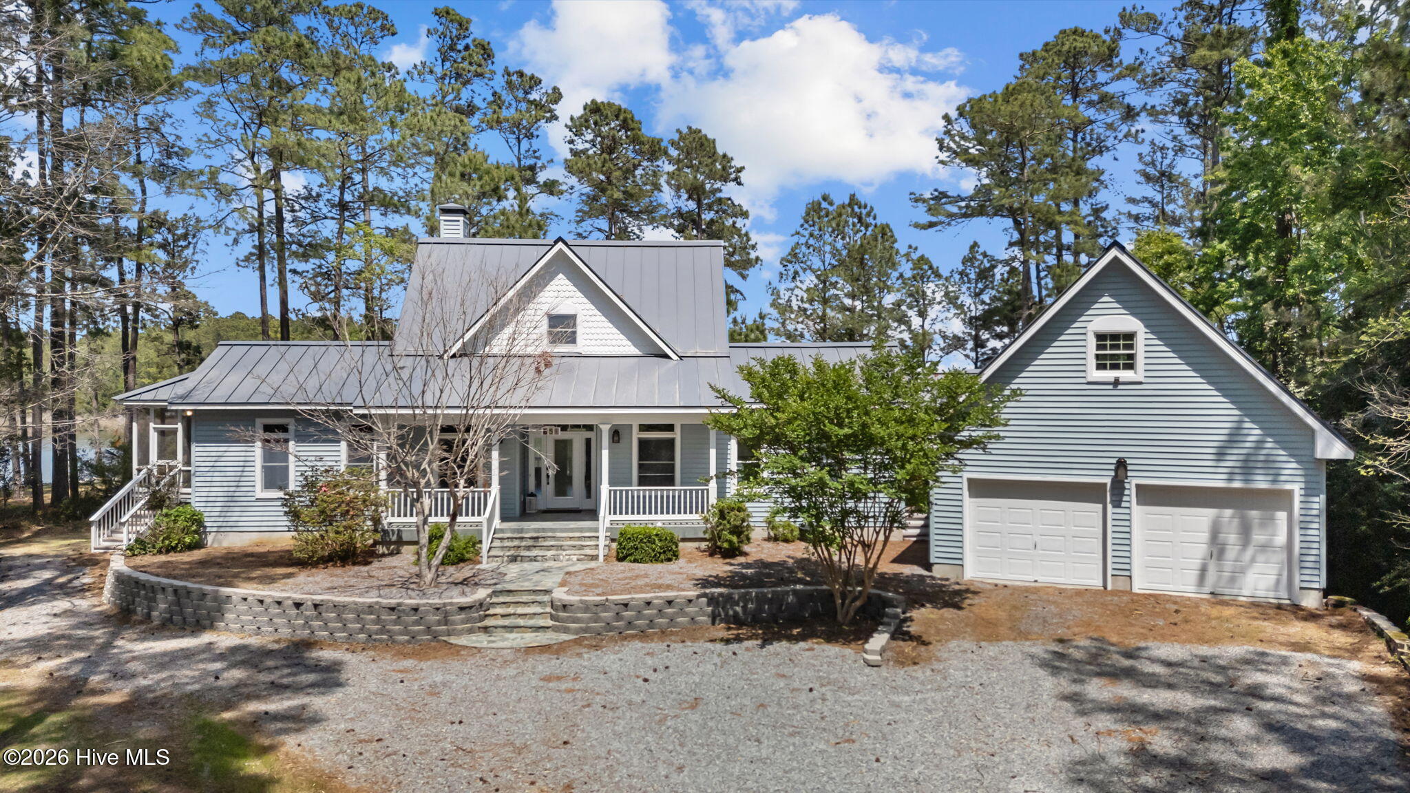 If ever a waterfront home enjoyed the glorious variety of Nature's gifts, this would be it! A custom 3 Bedroom residence perfectly defining and refining the peninsular setting it presides over. It allows the extremely rare combination of protected  dockage (on tranquil Pasture Creek) and dramatically powerful views of the broad waters of deep Ball Creek & the Bay River! Built to exacting specifications so to fully enjoy the magnificent water views with its newly refurbished bulkheading. With privacy and its sunny, but high-shaded front yard, this estate is a private paradise! The extensive shoreline (400'+-!) is mostly bulkheaded... The concrete pier has a boat lift ready for your fishing boat and room for a sailboat or yacht! A welcoming front porch ushers you into the home and the moment you enter the foyer, you'll be captivated by the views across the spacious and sunny living and dining areas to the sparkling waters beyond! Such a fine home designed around the needs of those who are frequent entertainers, adventurous cooks and yet desirous of comfortable, cozy spaces for quiet reflection and the pursuit of numerous interests! Wood & tile floors abound and the kitchen is amazing, with expansive soapstone counters, gourmet appliances and abundant cherry cabinets. A private master wing offers architectural interest in its magnificent ensuite bath, huge WIC and private porch! Upstairs are 2-bedrooms w/ bamboo floors and a lovely balcony akin to a ship's bridge overlooking the waters below! This residence truly offers elegant and convivial living in a one-of-a-kind package! Many extra features including: large semi-attached garage/workshop with a 16'5'' x 23'11'' space upstairs, new, zoned geothermal HVACs (2024), standby generator, private office & a big utility mudroom in which to change after a pleasant day on the water! A gas fireplace in the Living room and porches, decks and balconies from which to enjoy the waterfront splendor... This jewel awaits your visit!