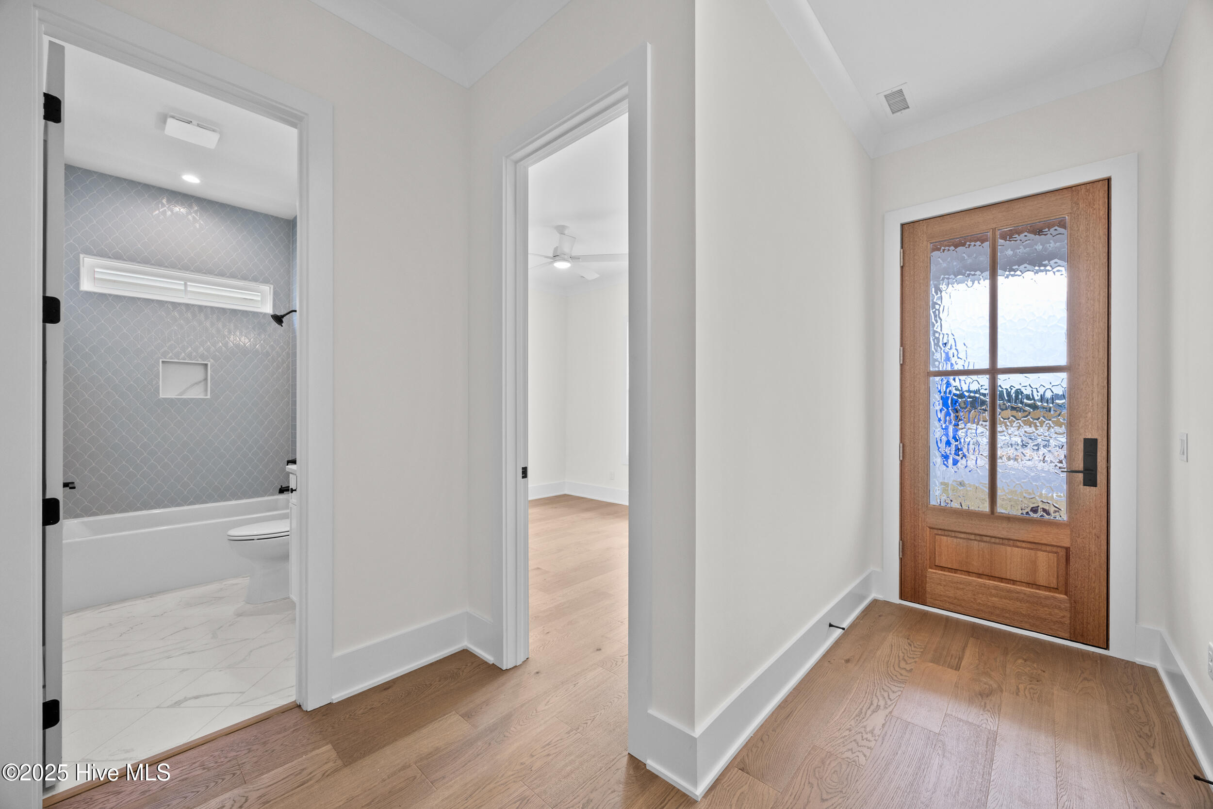 Foyer and hallway to bathroom and bedroom