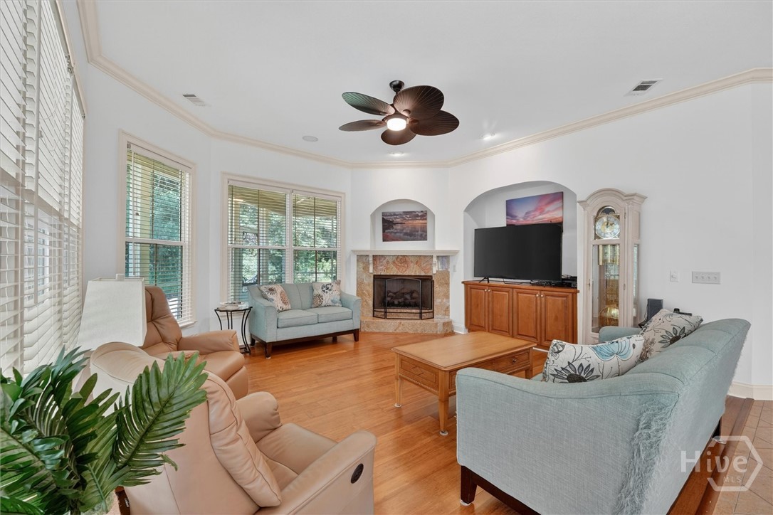 Spacious family room with gas fireplace and built-in media cabinet