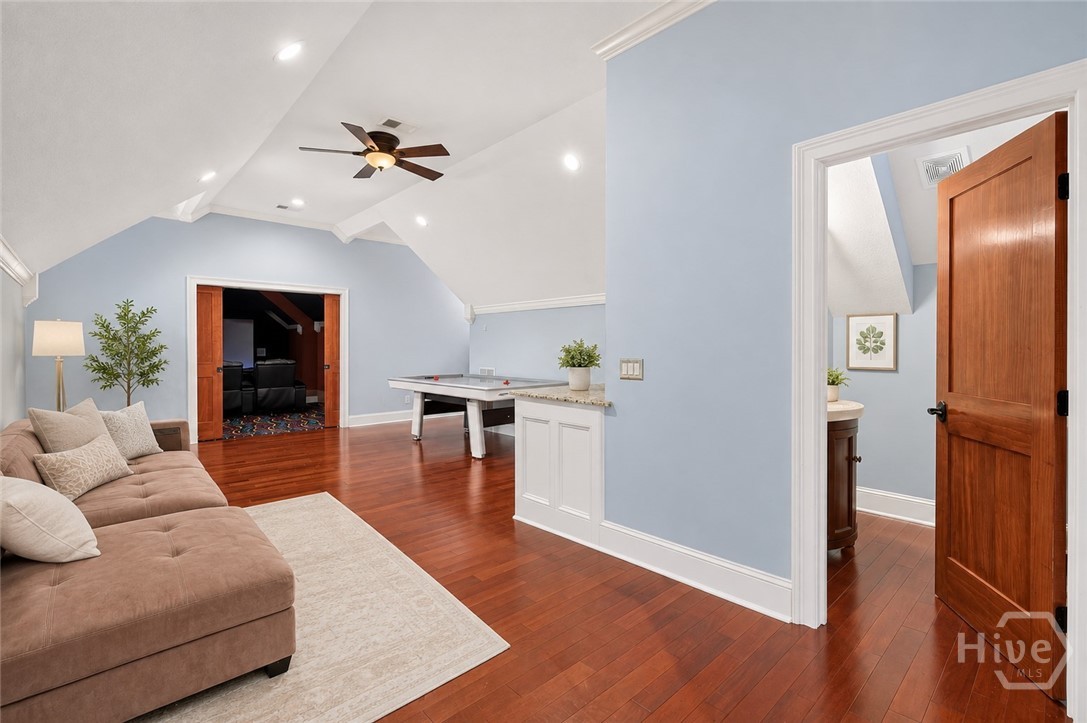 Game room area, 1/2, wet bar and theatre to left